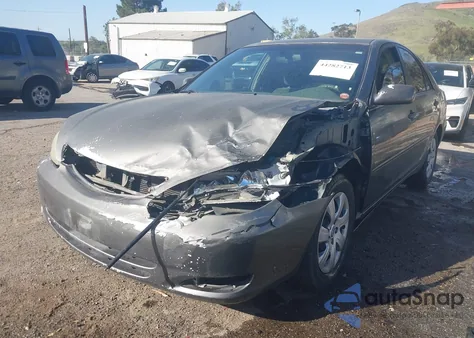 2004 Toyota Camry Le z USA, uszkodzony, nr VIN JTDBE32K940262471